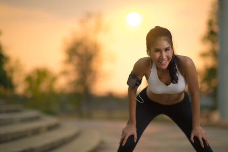 Asian women break from joggingの写真素材