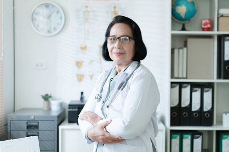 Senior asian doctor Working in the examination roomの写真素材
