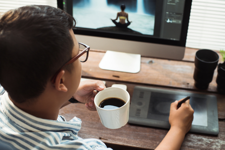 Photographer  retouching photos in the studio.の写真素材