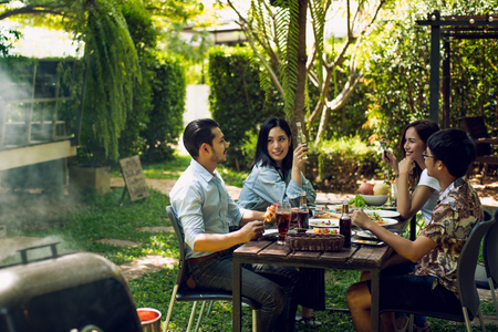 Afternoon Party, barbecue and roast pork They talk happily.の写真素材