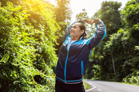 Asian women warm up by stretching in the morning.