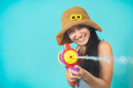 Asian people are using water guns Play in Songkran Festival She applied the powder on the face. The studio conceptの写真素材