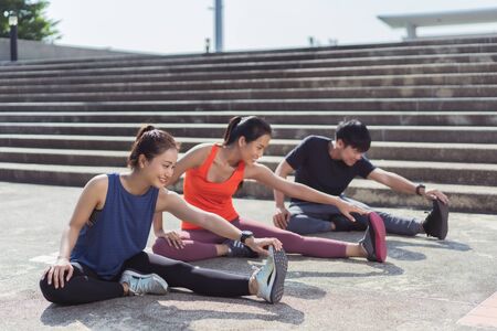 Asian friends group jogging in the morning They are warming upの写真素材