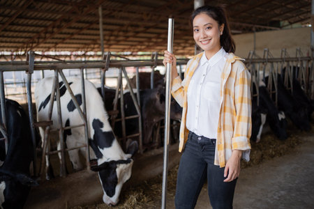 Portrait asian owner of a cow farm standing on the farm