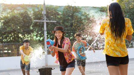 Asian people are using water guns play songkran festival in the summer aprilの写真素材