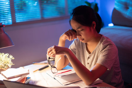 Asian women tired from working at home, She felt sleepy .