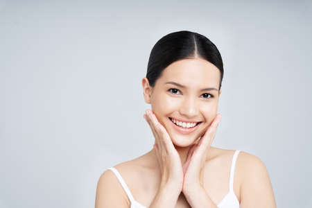 Beautiful woman asian face close up.She is smilingの写真素材