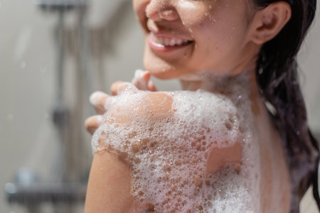 Woman bathing and washing her hair relaxed.の写真素材