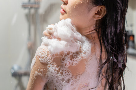 Woman bathing and washing her hair relaxed.の写真素材