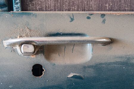 Abandoned car with missing lock part.の写真素材