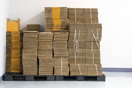 stack of flat pack cardboard boxes for product packaging and delivery.の写真素材