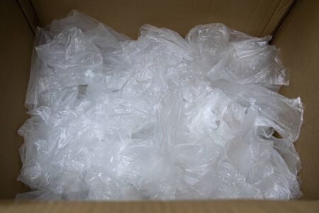 used plastic bag in paper box for recycling.の写真素材