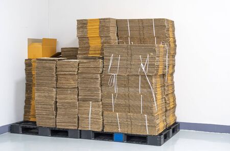 stack of flat pack cardboard boxes for product packaging and delivery.の写真素材