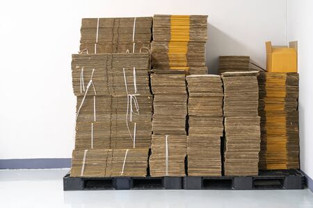 stack of flat pack cardboard boxes for product packaging and delivery.の写真素材