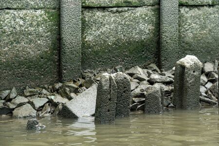abandoned concrete poles in the river.の写真素材