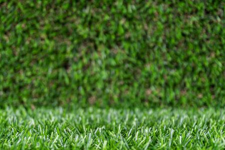 artificial grass backdrop with selective focus.の写真素材