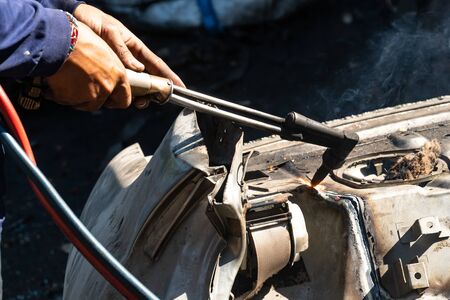 Oxy-Fuel Cutting Torch to cutting car for metal recyclingの写真素材