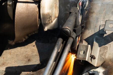 Oxy-Fuel Cutting Torch to cutting car for metal recyclingの写真素材