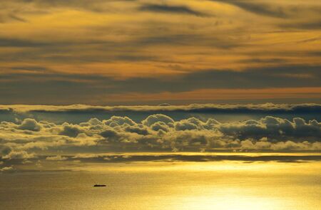 Landscape of clouds over the sea at dawnの写真素材