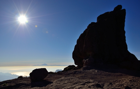 Intense sunset and rock of the frog, Gran canaria, Canary islandsの写真素材