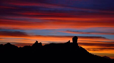 Awesome sunset with the multicolored sky, Roque Nublo, Gran canaria, Canary islandsの写真素材
