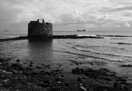 Old defensive tower of San Cristobal, bay of Las Palmas, Canary Islands, black and white modeのeditorial素材