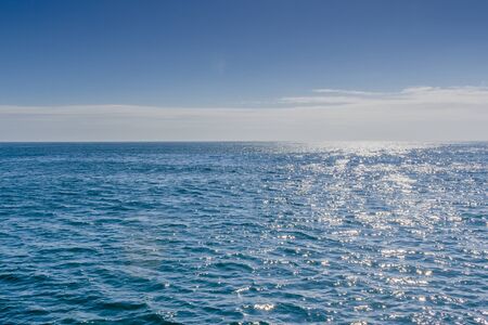 Blue sea with sunlight reflected on itの写真素材