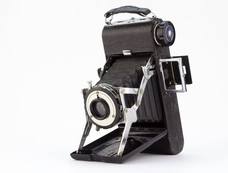 Antique well used rusty old photographic camera isolated on white backgroundの写真素材