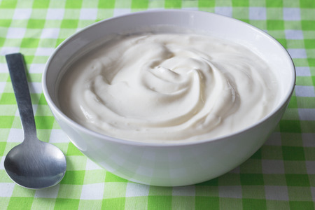 Natural plain white Greek yoghurt in bowl closeup - Yogurt backgroundの写真素材