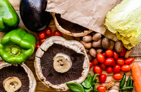 Vegetable background, top view photo of fresh vegetables and black mushrooms close up.の写真素材
