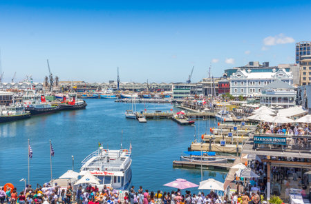 CAPE TOWN , SOUTH AFRICA - 01 JANUARY 2020: V & A Waterfront with many tourists celebrating a summer New Years day at the Cape Town harbourのeditorial素材