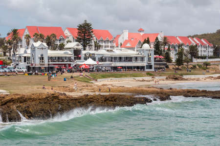 PORT ELIZABETH, SOUTH AFRICA - FEBRUARY 01 2020: Restaurants and pubs at the Beachfront Boardwalk in Summerstrand Port Elizabeth with people taking a morning stroll  - Photo taken from Shark Rock Pierのeditorial素材