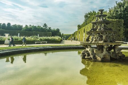 Tourists strolling the Chateau de Versailles Gardens in Paris, France.のeditorial素材