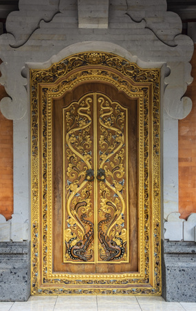 Decorated door at the Gunung Kawi Sebatu Temple, Ubud, Bali, Indonesia. The temple complex is located within the highland village of Sebatu in Tegallalang, Gianyar, approximately 12km northeast from the main Ubud hub.の写真素材