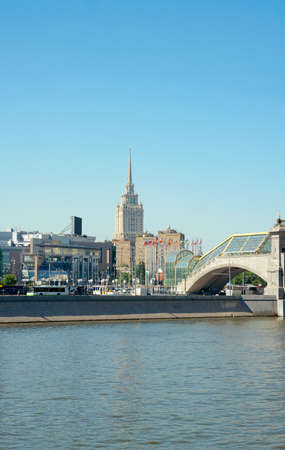 View of Bogdan Khmelnitsky (Kievsky) Pedestrian Bridge (2001), Square of Europe and Radisson Royal Hotel (Hotel Ukraina, 1957 by A. Mordvinov and V. Oltarzhevsky) from Savinskaya embankment. Moscow, Russiaのeditorial素材