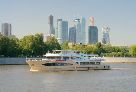 Moscow, Russia - July 14 2014: View of Moscow river, pleasure boat and Moscow International Business Center (Moscow City) from Luzhnetskaya embankment.のeditorial素材