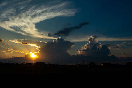 Summer sunset, entrance clouds and sunset sky In early August, the entrance clouds reminiscent of midsummer were illuminated by the setting sun and it was a beautiful sunset.の写真素材