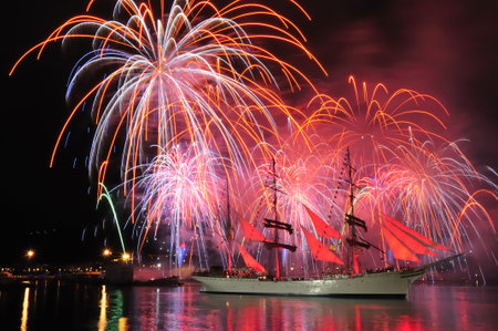 A big sailboat, sailship with fireworks in the background.の写真素材