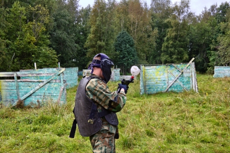 Paintball players in full gear at the shooting rangeの写真素材