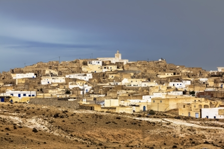 The town Matmata in Tunisia amid lightning skyの写真素材