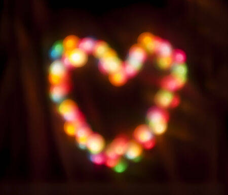 Colored balls Bokeh in the form of heartsの写真素材