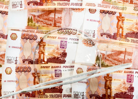SOAP bubbles against a backdrop of us banknotes in denominations of five thousand rubles