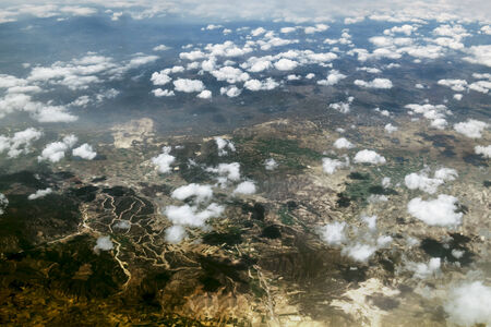 Look at the clouds and the Earth from a height of ten thousand feetの写真素材