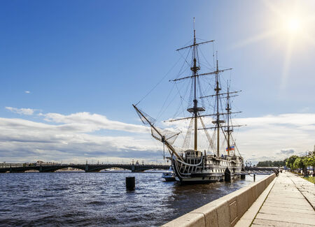A sailboat on the river Neva and the TroitskyBridge in Saint Petersburg, Russia on a sunny dayの写真素材