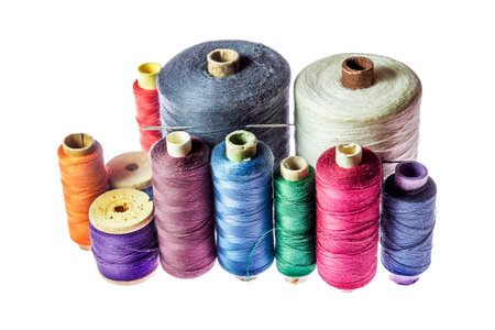 Coil with multicolored threads, isolated on white background