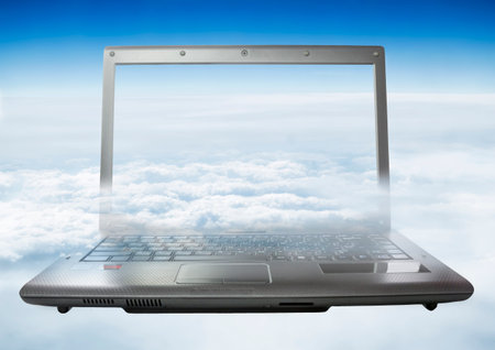 Laptop with a heavenly landscape on the screen and the background