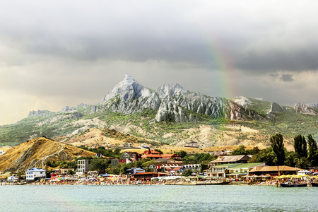 Small town KOKTEBEL, Crimea, 04 september 2011. Vacationers on a City Beach in the settlement KOKTEBEL in Crimeaのeditorial素材