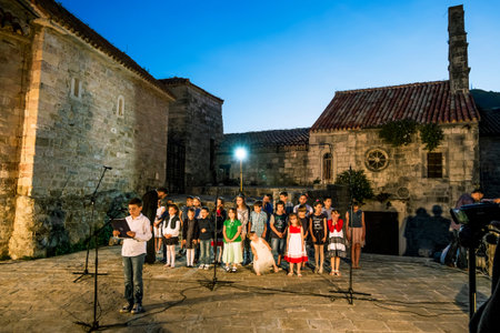 May 31, 2015.Children's Choir performs at Pentecost in the old town of Budva, Montenegroのeditorial素材