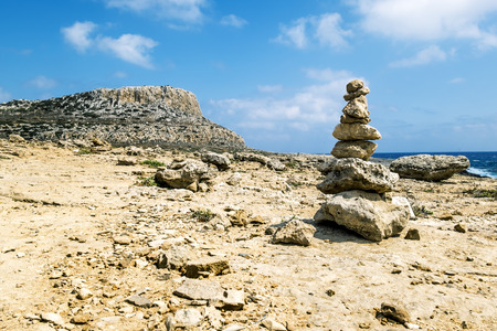 25 may 2016.Cape Greco. A view of the pyramid of stones on the rocks of Cape Greco . Cyprus.のeditorial素材