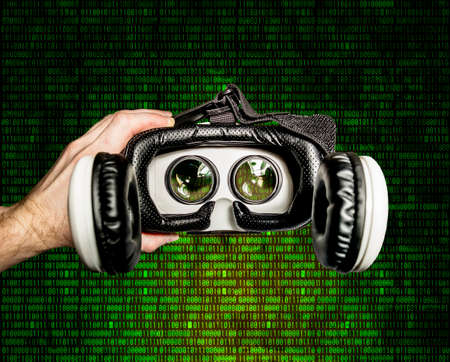 Helmet of virtual reality with smartphone against the background of running matrix figuresの写真素材